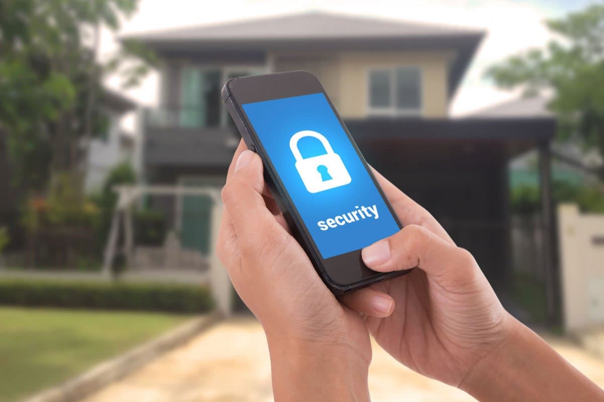 Homeowner arming their security system from a mobile app
